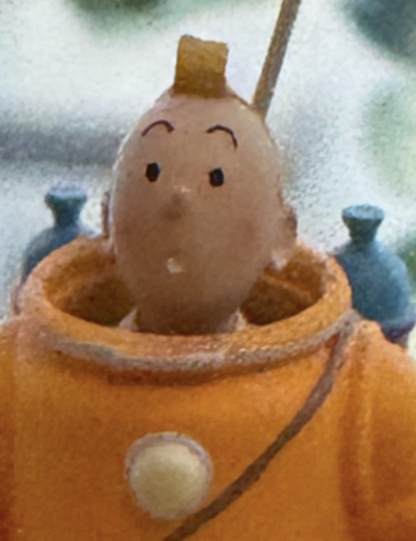 Figurine, iPhone 16 Pro 12 MP image at ×20 zoom, camera app